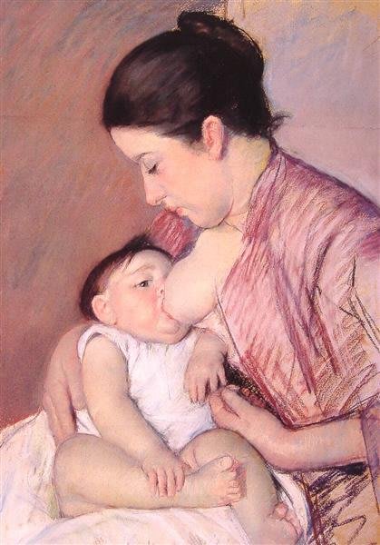 Femme tenant un bébé dans ses bras, image tendre de la maternité.